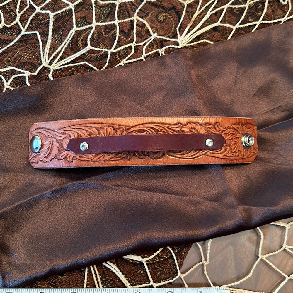Leather cuff.